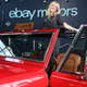 A photo of Sydney Sweeney standing in the back of her Ford Bronco.